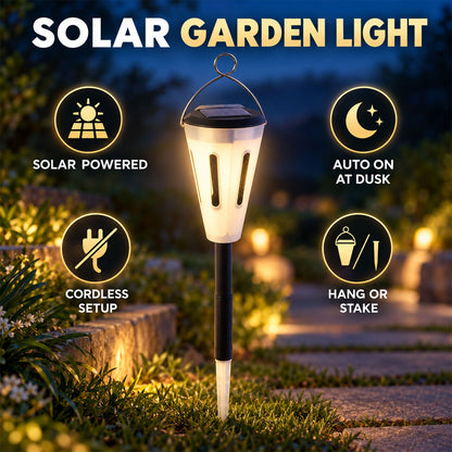 A solar garden light stands on a path with icons indicating it is solar-powered, auto-on at dusk, cordless, and can hang or
