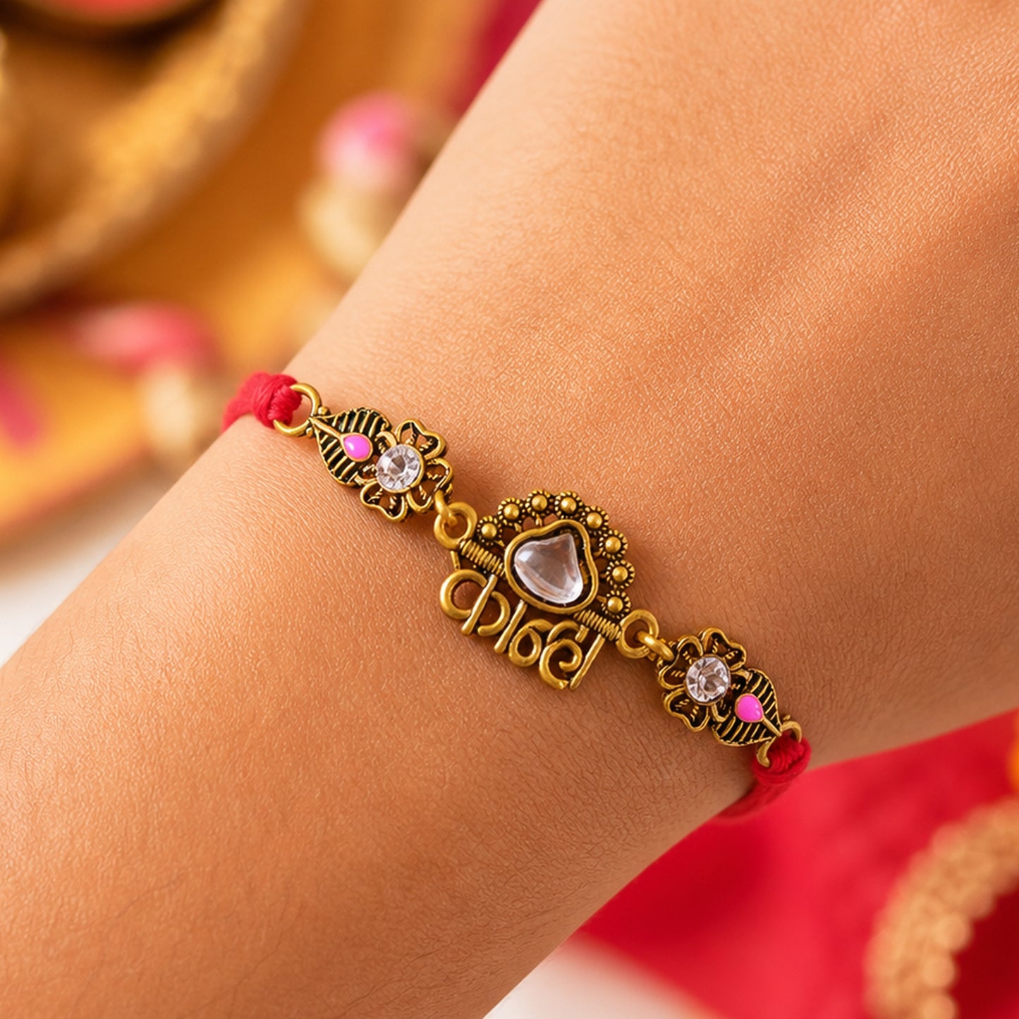 Antique Gold-Toned Kanha Rakhi with Kundan-Style Stone, Crystal Accents & Red Thread