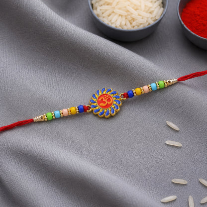 Om Designer Rakhi with multicolor beads on white background