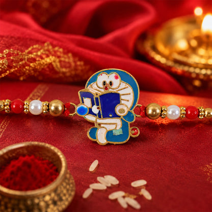 Doraemon Kids Rakhi with Red Gold Beads and Playful Blue Charm