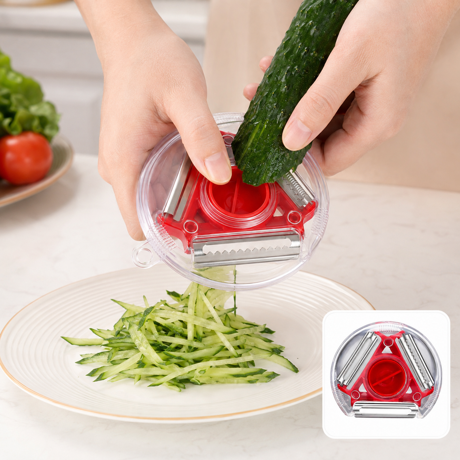 A person uses a red and clear rotary peeler to julienne a cucumber into a pile on a white plate.