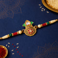 Classic Rakhi featuring Kalash Charm and red stone accents in chain look for Gift Use