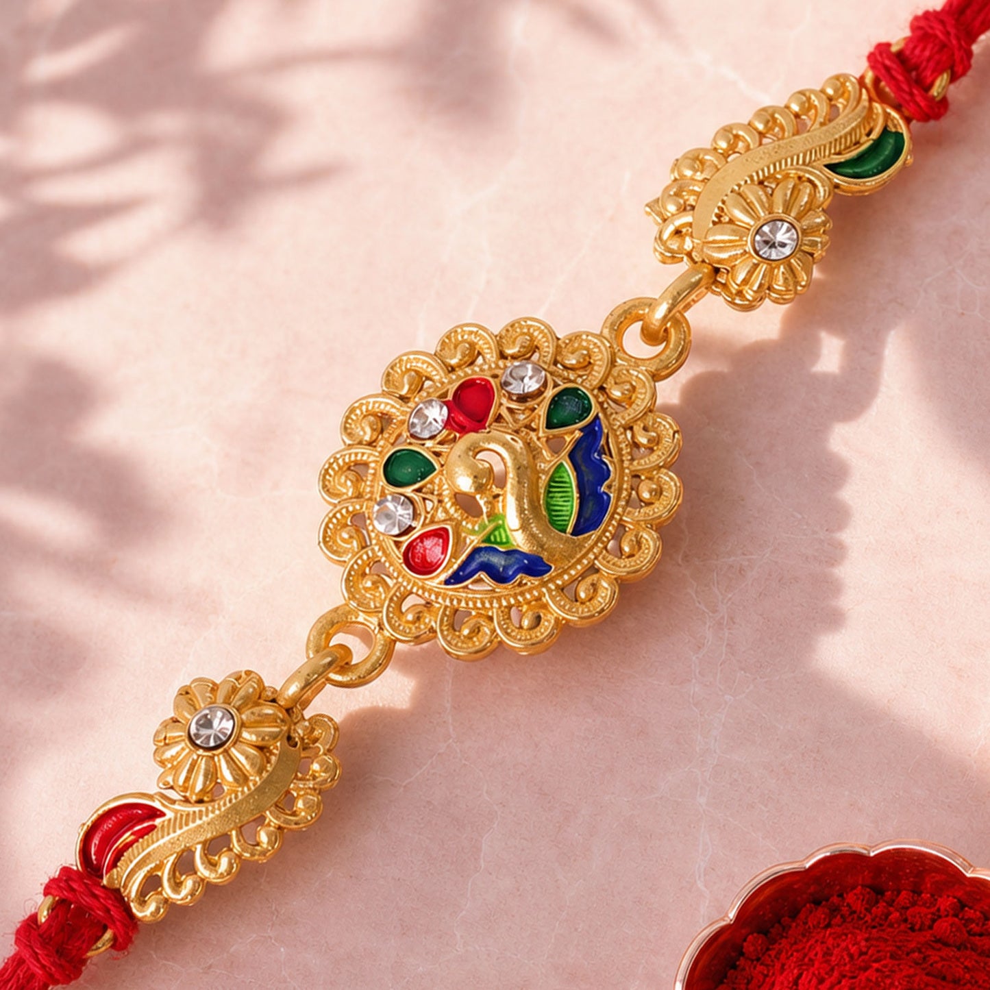 Graceful Rakhi with Floral Medallion, pink green stones and bead line for Gift Use