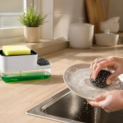 Dish soap dispenser and sponge holder on countertop in kitchen