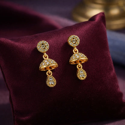 Gold-tone floral dome drop earrings with sparkling crystal studs front view