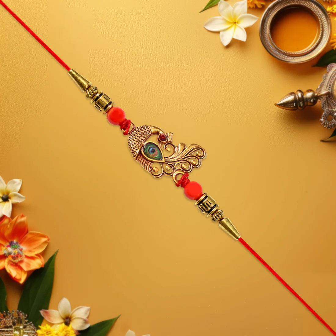 Peacock Rakhi with golden stone and bead embellishments on a festive background.