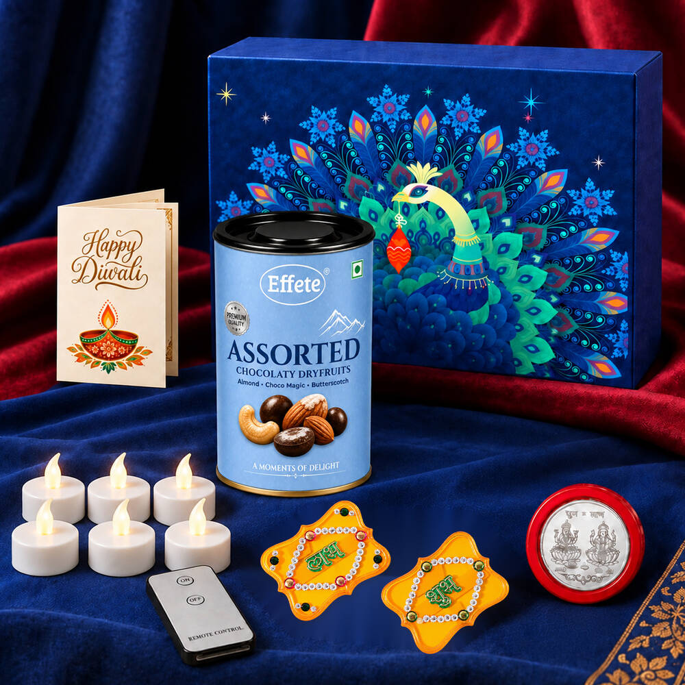 A blue peacock-patterned box, a tin of assorted dry fruits, a Diwali card, six white LED tealights, a remote, two – view 3