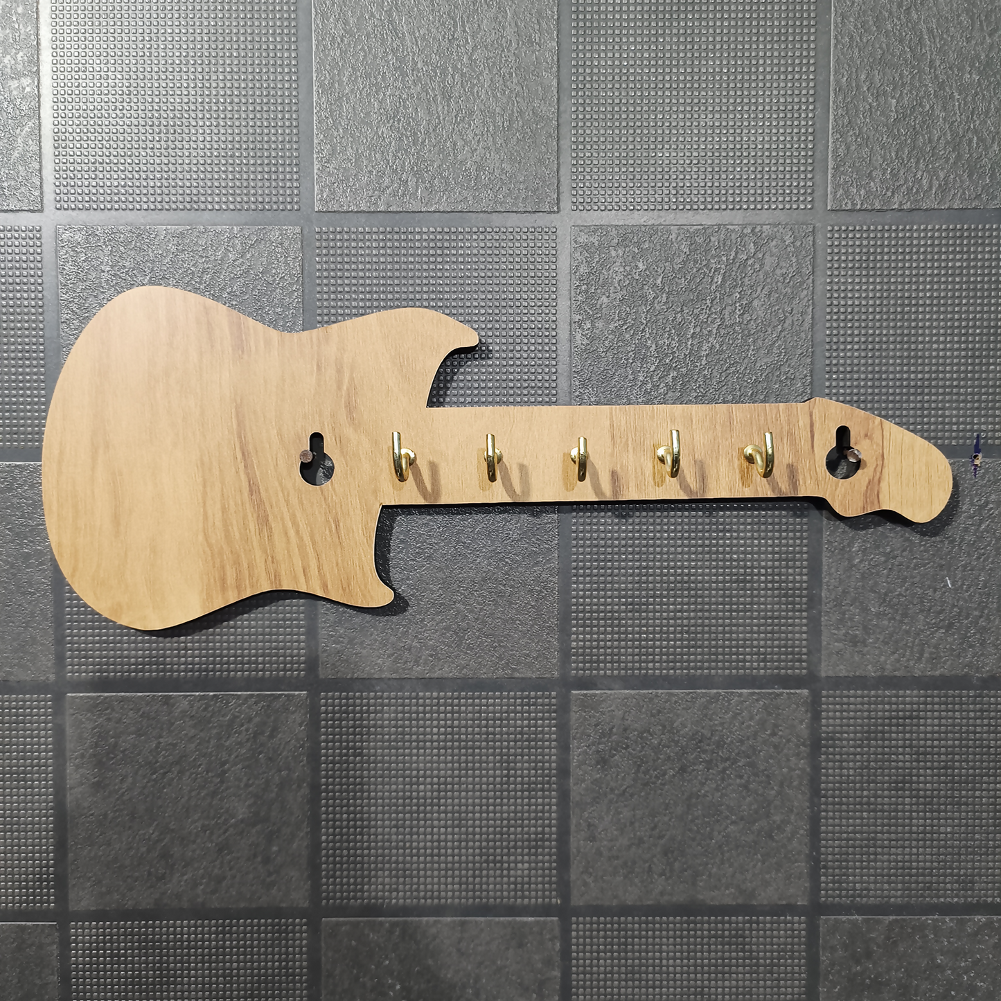 Side view of guitar shape wooden key holder
