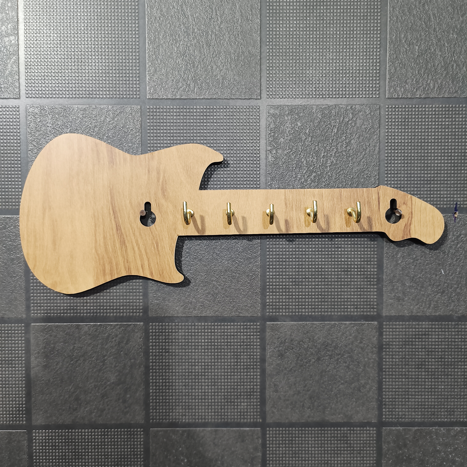 Side view of guitar shape wooden key holder