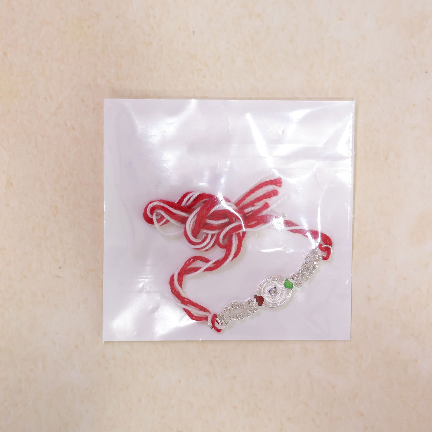 Silver-Toned Crystal Rakhi with Circular Designer Centerpiece, Dual Stone Chains & Red Thread