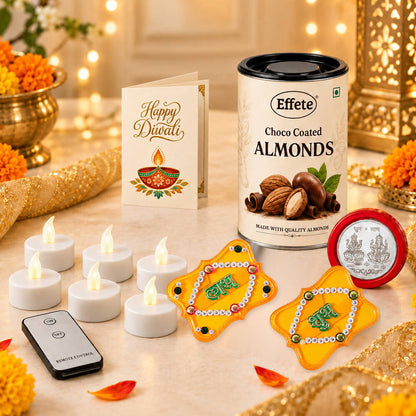 A Diwali gift set with choco almonds, LED tealights, and Shubh-Labh decorations is displayed on a marble surface with warm
