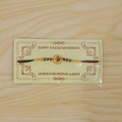 Peacock Floral Golden Rakhi with Blue Green Enamel, Red Beads and Decorative Centre