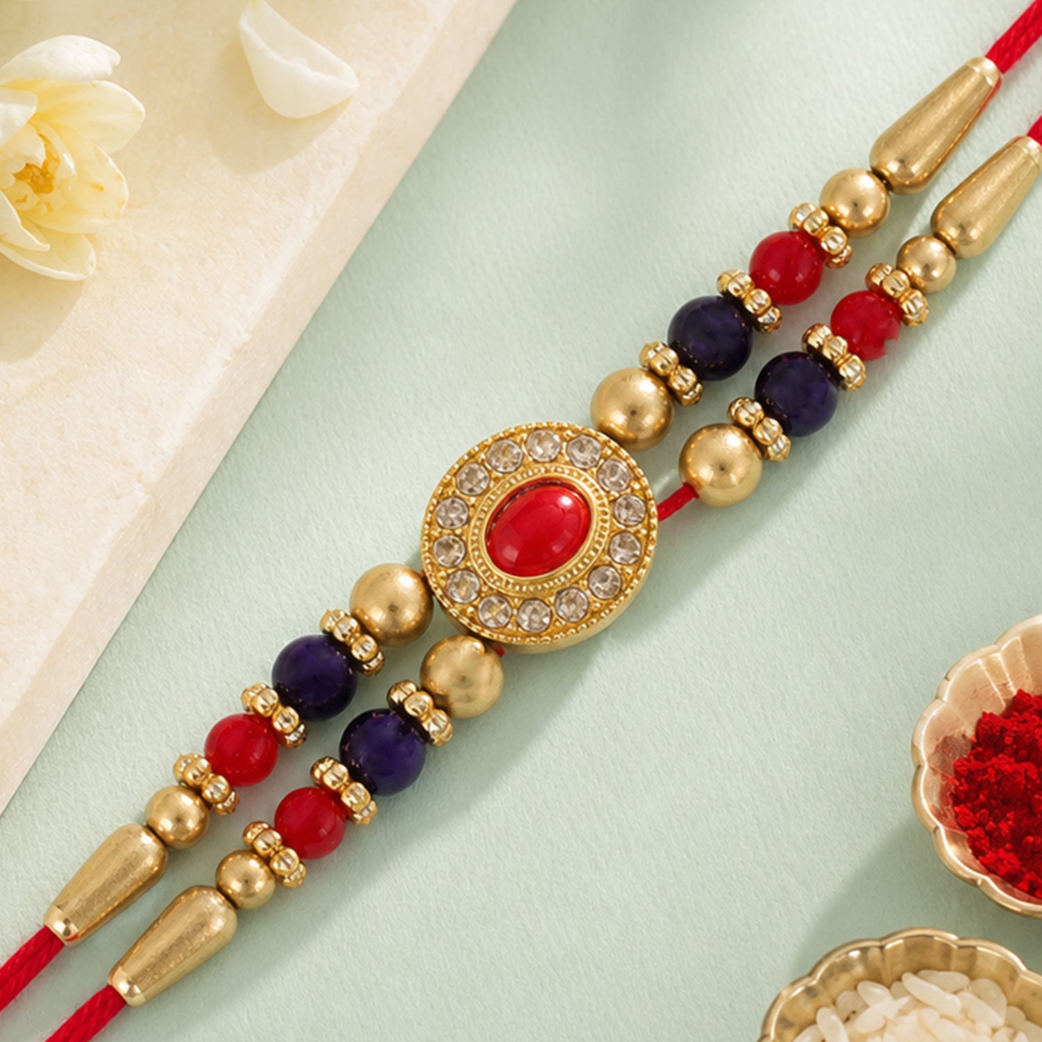 Red Blue Beaded Rakhi with Ruby Center and Rich Traditional Festive Gift Styling