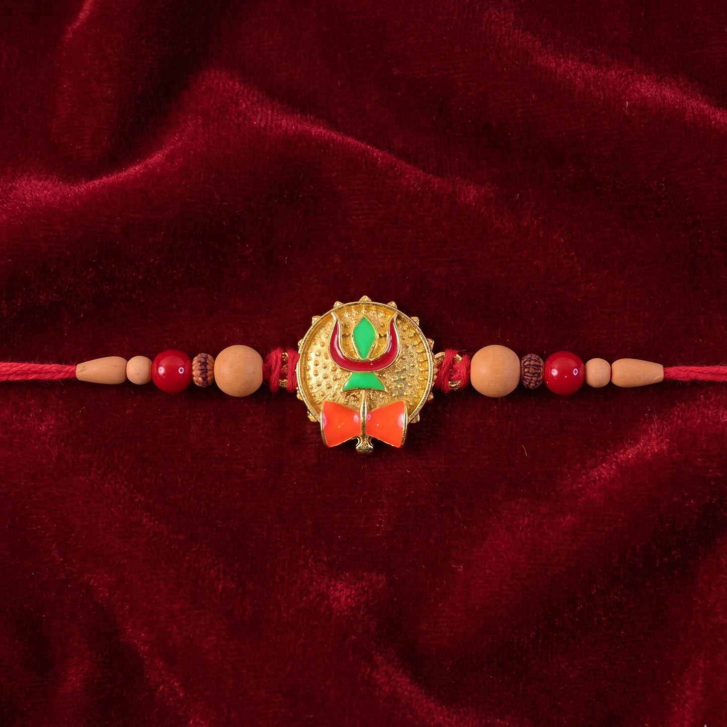 Trishul Damru Rakhi with Peach Beads and Red Thread