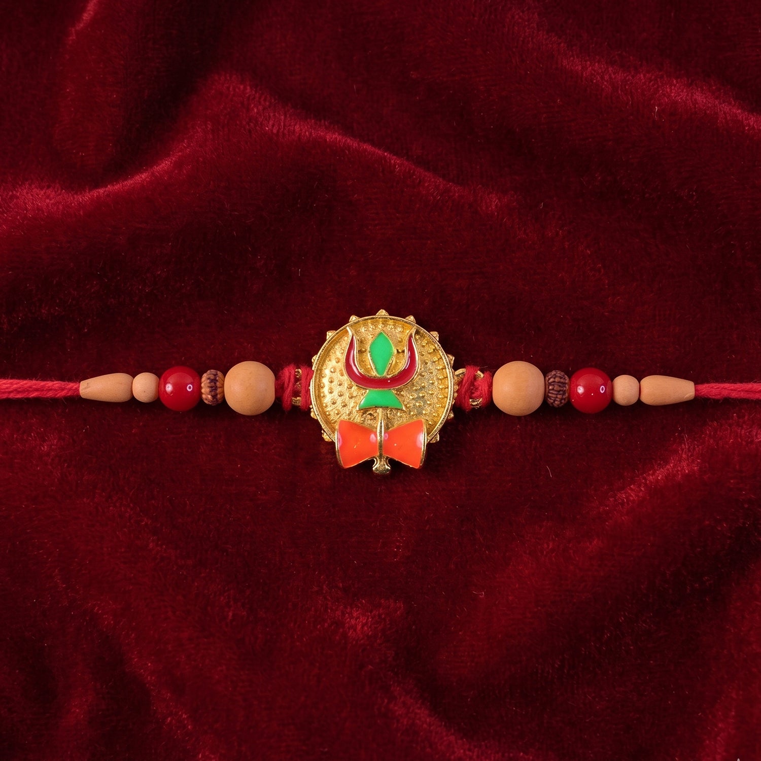 Trishul Damru Rakhi with Peach Beads and Red Thread