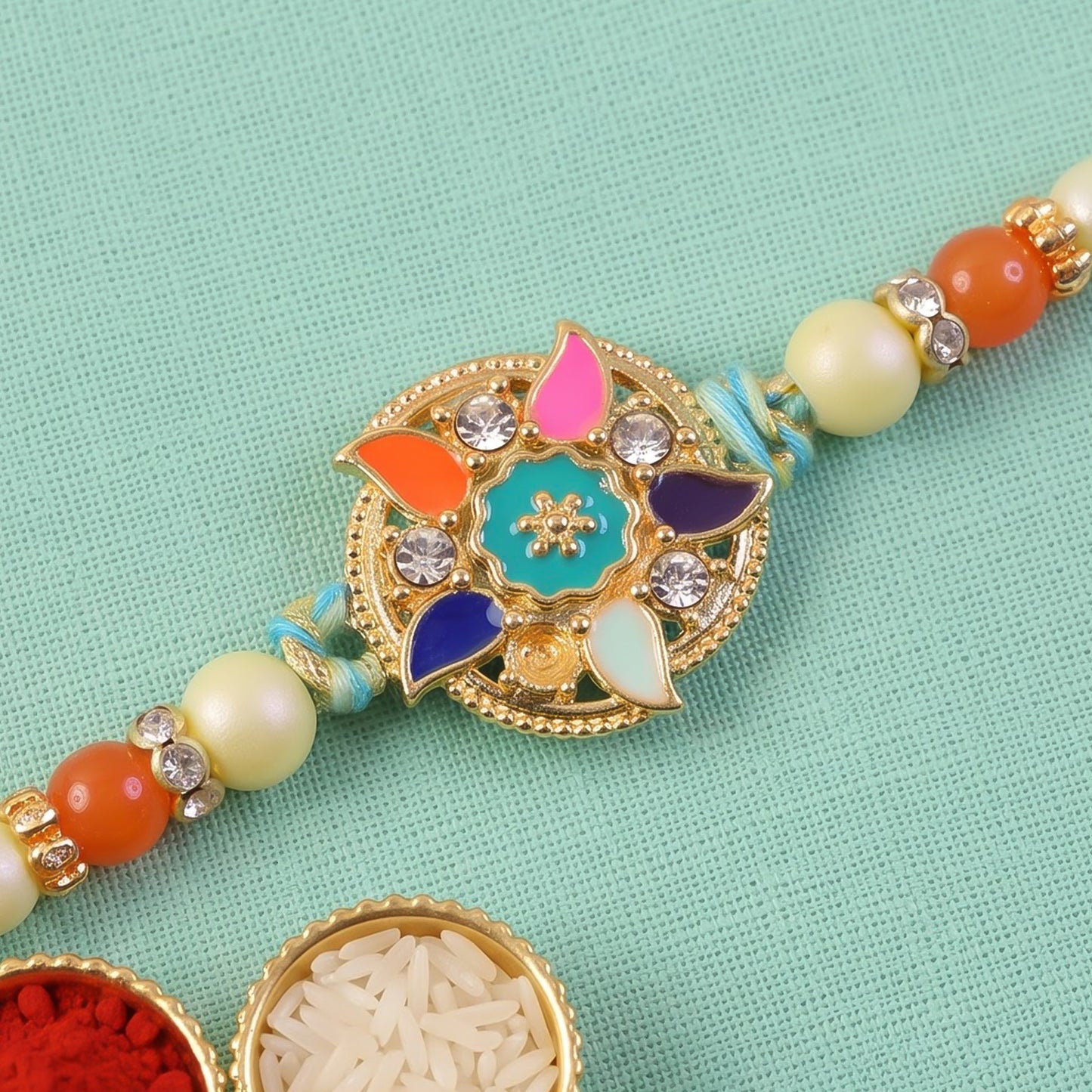 Multicolor Floral Kundan Pendant Rakhi with Pearl and Orange Beads