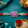 Silver-Toned Shree Rakhi with Pink Enamel, Crystal Accents & Designer Red Thread