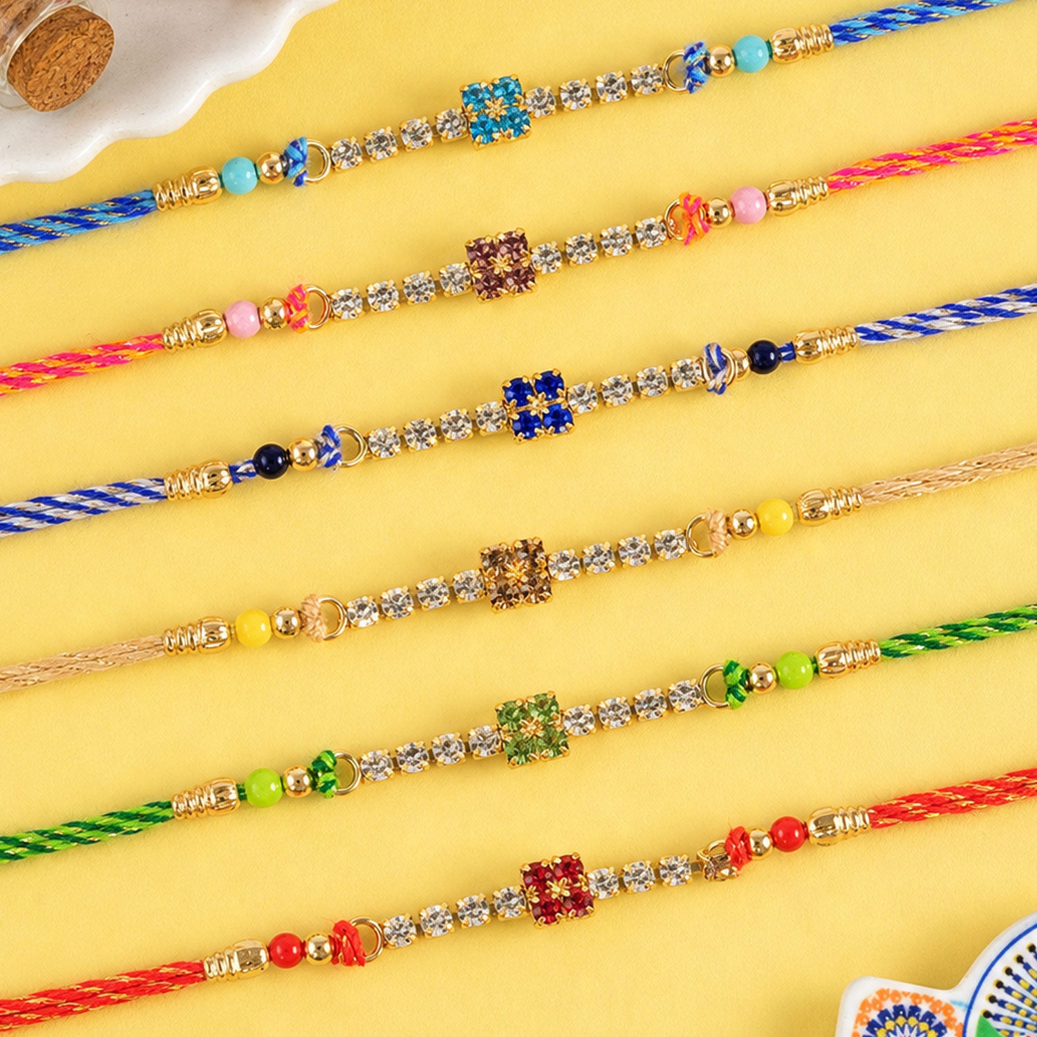 Square Motif Stone Band Rakhi in Mix Colour Threads (Pack of 6)