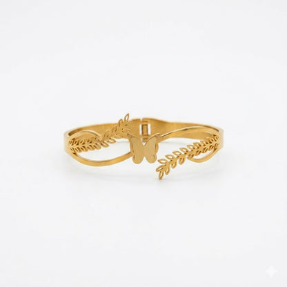 Side view of gold-tone floral kada bracelet
