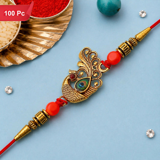 A red string band with a golden peacock charm, red beads, and golden accents is displayed on a light blue background with