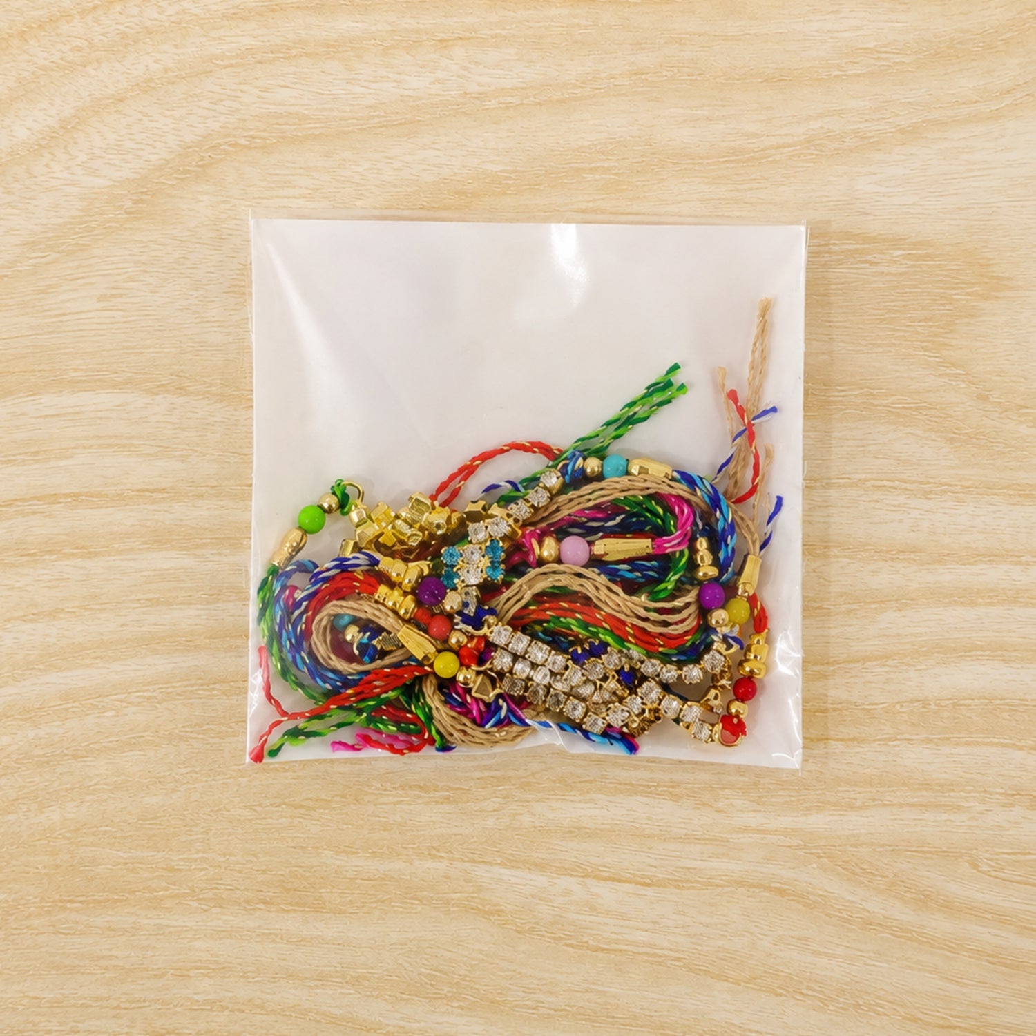 Compact Square Stone Rakhi in Mix Colour Threads (Pack of 6)