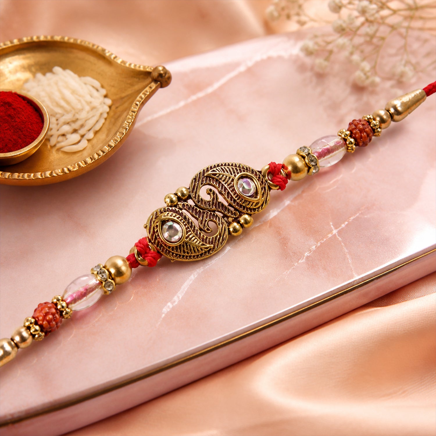 Antique Twin Paisley Kairi Motif Kundan Rakhi with Rudraksha & Crystal Beads