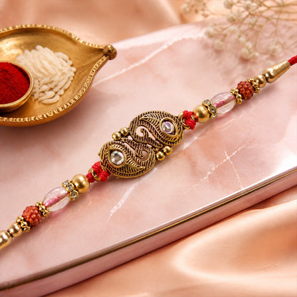 Antique Twin Paisley Kairi Motif Kundan Rakhi with Rudraksha & Crystal Beads