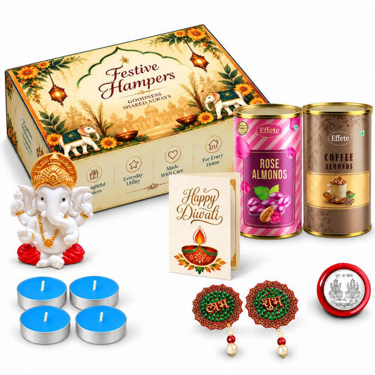 A festive gift box with a Ganesha idol, two almond tins, a Diwali card, four tealights, and two decorative hangings.