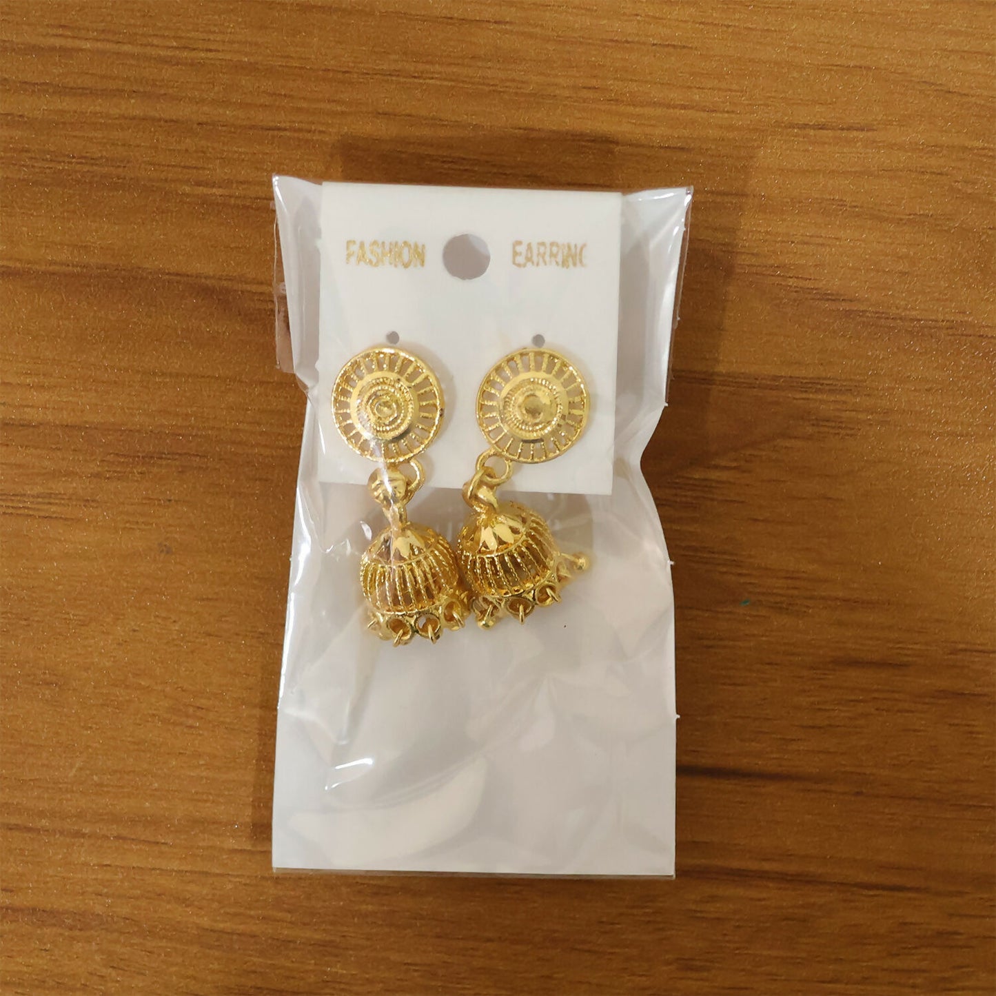 Ethnic style gold plated jhumka earrings with detailed patterns