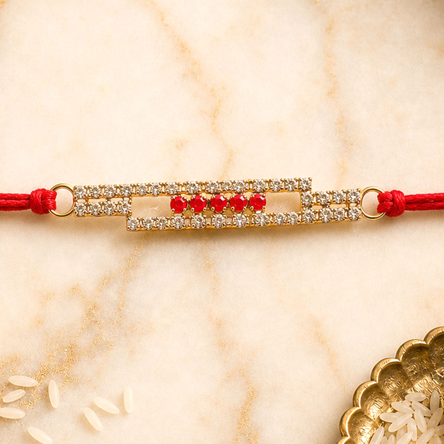American Diamond Rakhi with slim studded bar and red thread