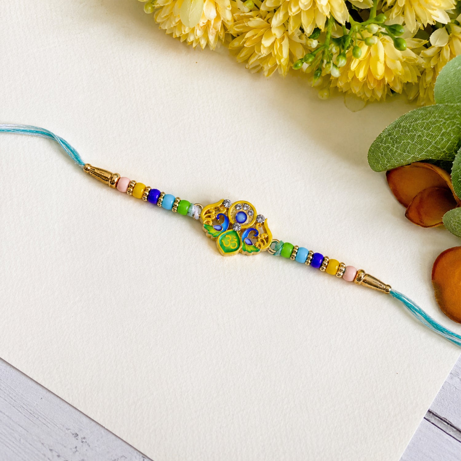 Peacock Design Premium Rakhi with decorative beads on soft thread
