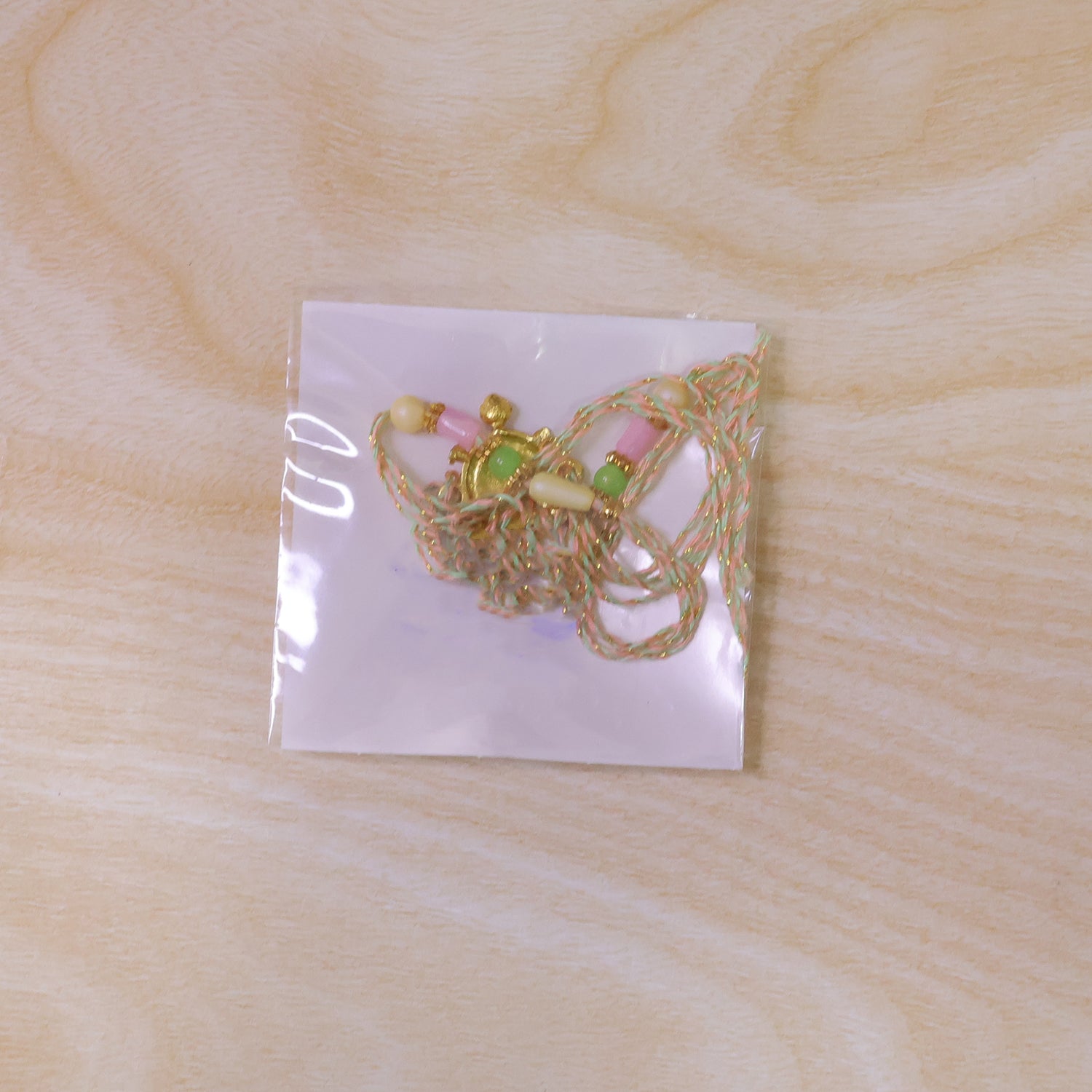 Enamel Tortoise Pendant Rakhi with Pastel Beads