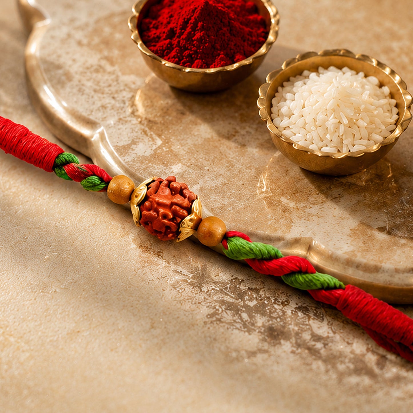 Green Red Designer Rakhi with Golden Bead Accents and Traditional Festive Beauty
