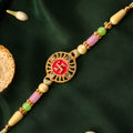 Swastik Pendant Rakhi with Kundan Stones and Pastel Beads