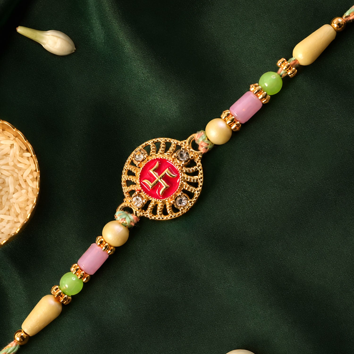 Swastik Pendant Rakhi with Kundan Stones and Pastel Beads