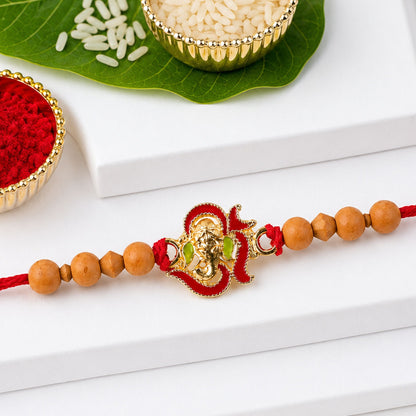 Lord Ganesha Rakhi with sandalwood beads and traditional design.