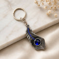 Blue Stone Peacock Feather Keychain with Silver Tone Decorative Design