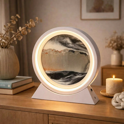 Close-up of moving sand inside round LED lamp
