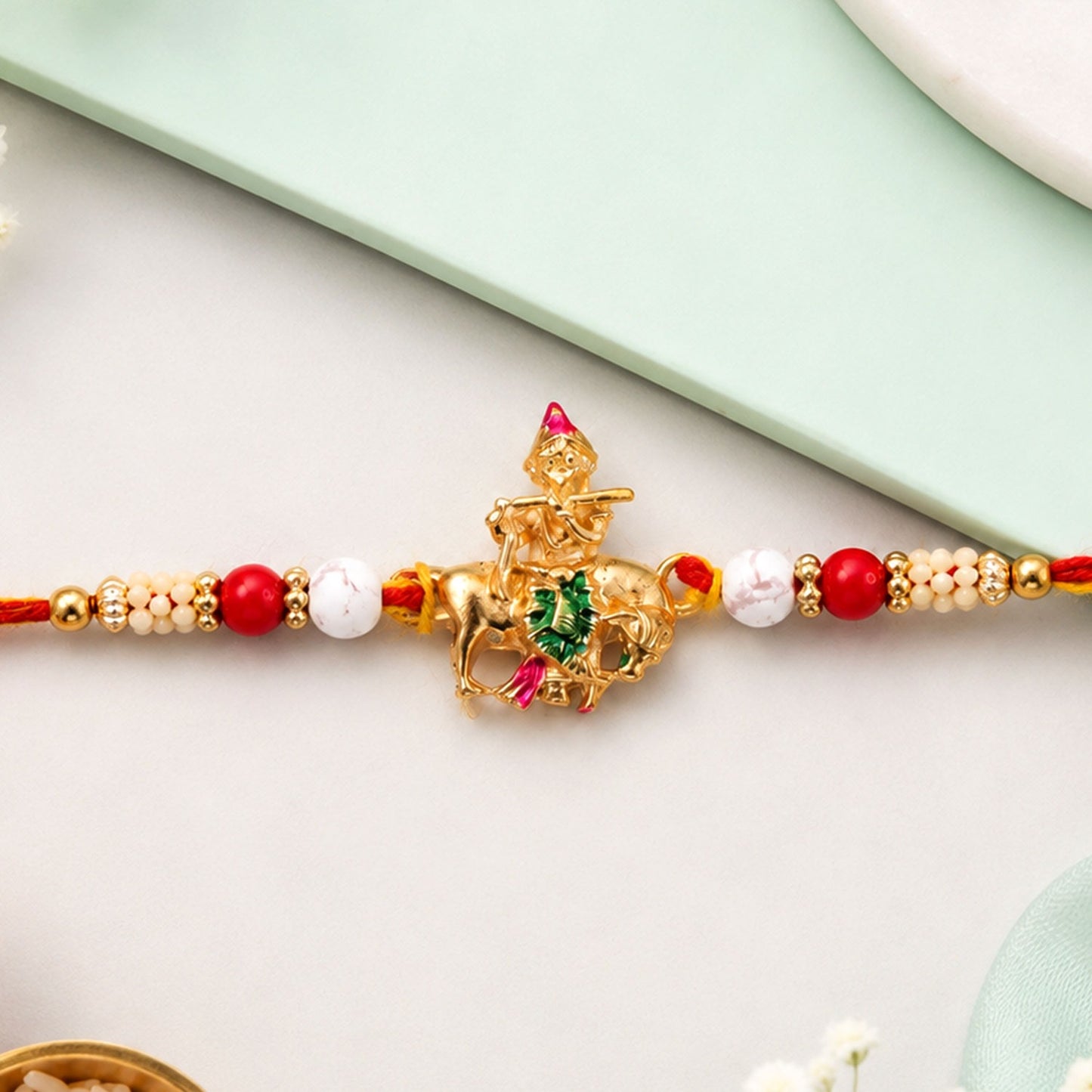 Lord Krishna beaded rakhi for brother, featuring a divine motif and vibrant beads, perfect for Raksha Bandhan celebrations.