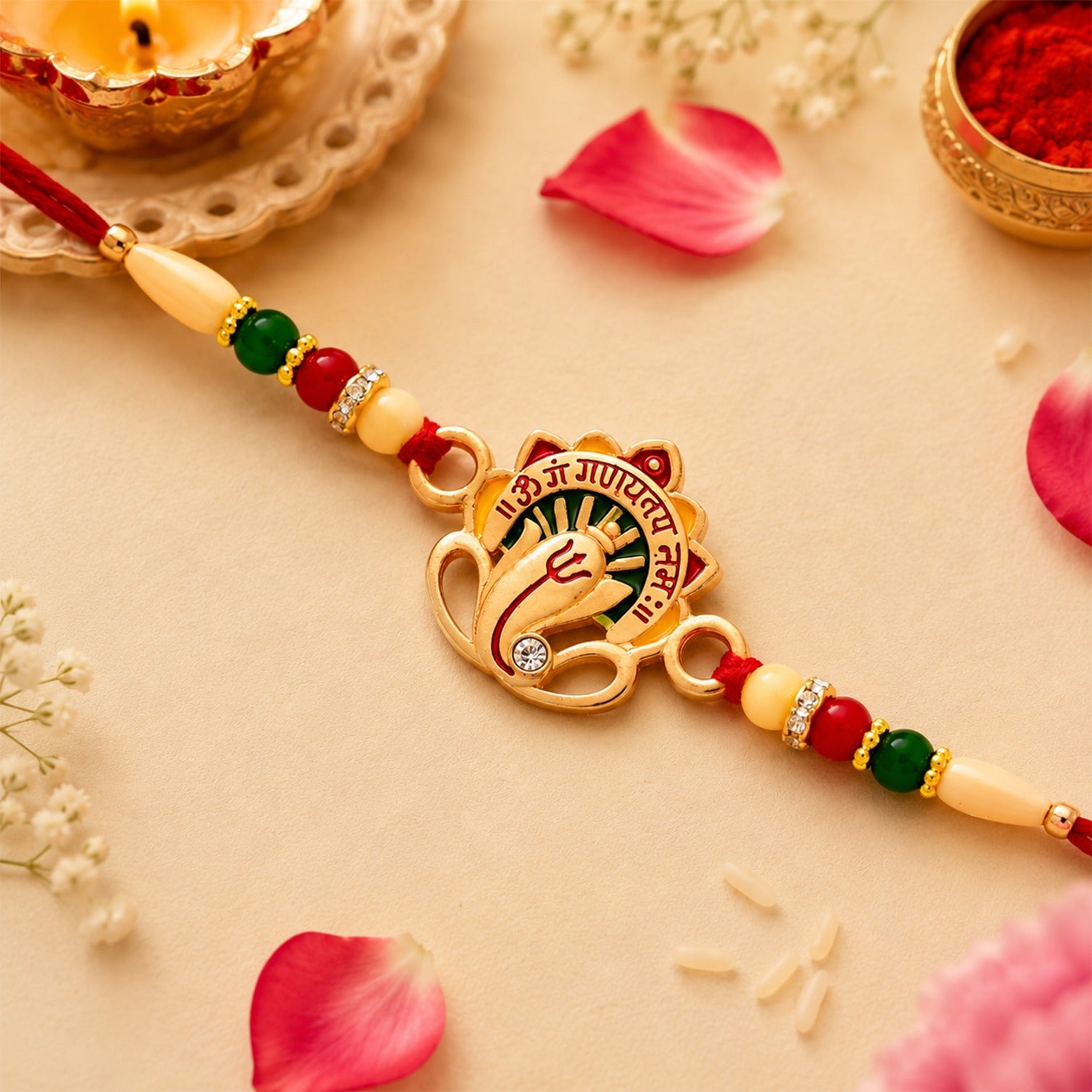 Om Ganesha Rakhi featuring intricate traditional beadwork and sacred design.