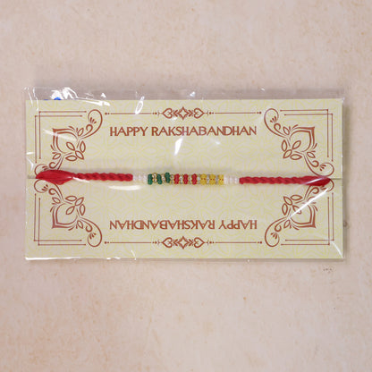 Red Braided Rakhi with Green, Yellow and White Bead Pendant Row