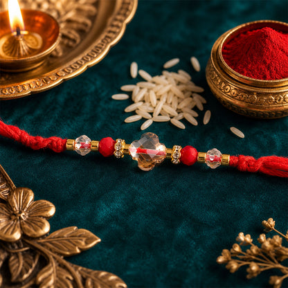 Red Thread Rakhi with a Row of Sparkling Crystal Bead Pendant Accents