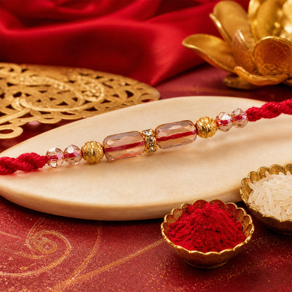 Red Thread Rakhi with Crystal Bead Pendant and Golden Bead Accents