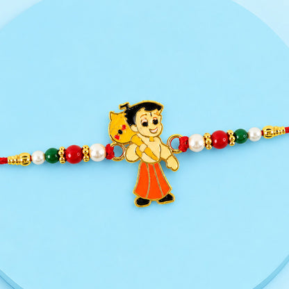 A red thread bracelet features a cartoon boy charm with a yellow bag, flanked by red, green, and white beads.