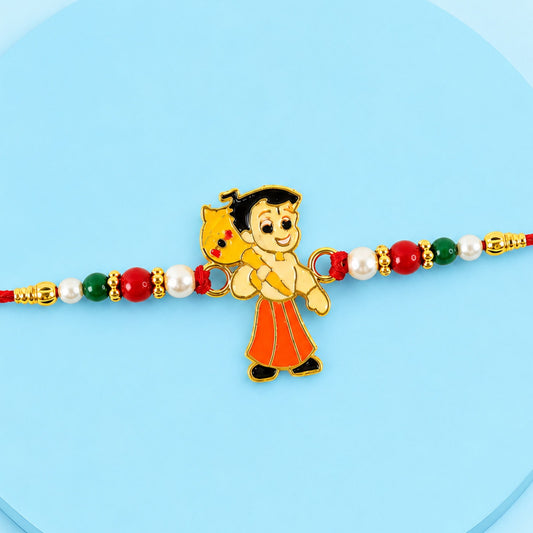 A red thread bracelet features a cartoon boy charm with a yellow bag, flanked by red, green, and white beads.