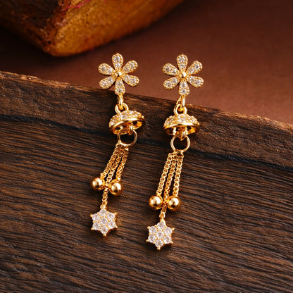Rose gold drop earrings featuring sparkling starburst floral design