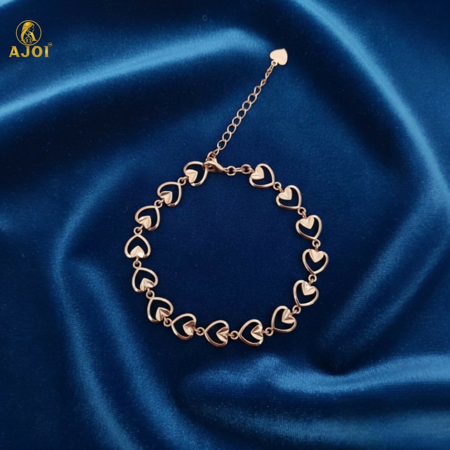 Side view of delicate heart link gold plated bracelet for women