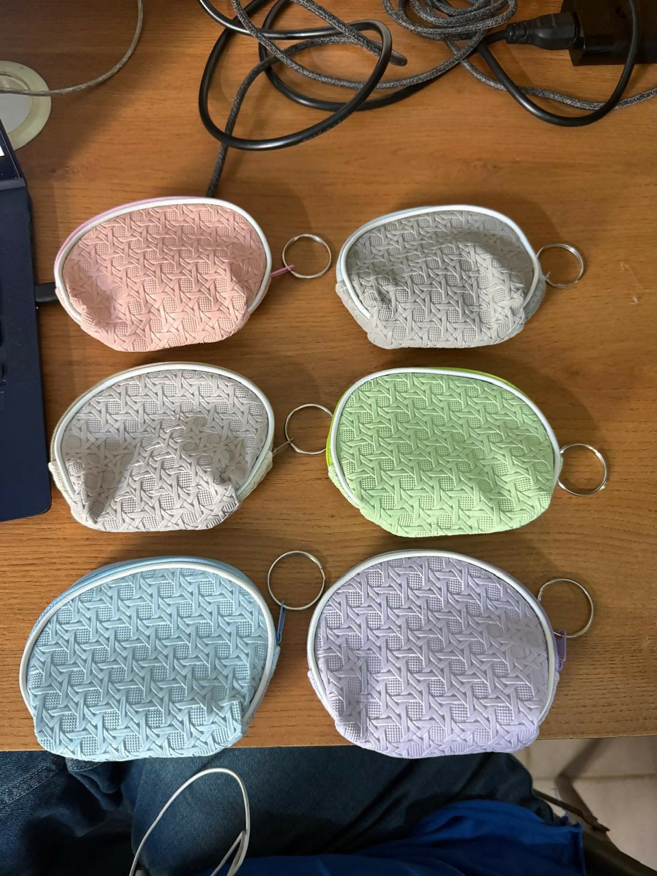 Mini coin pouch next to coins and cards