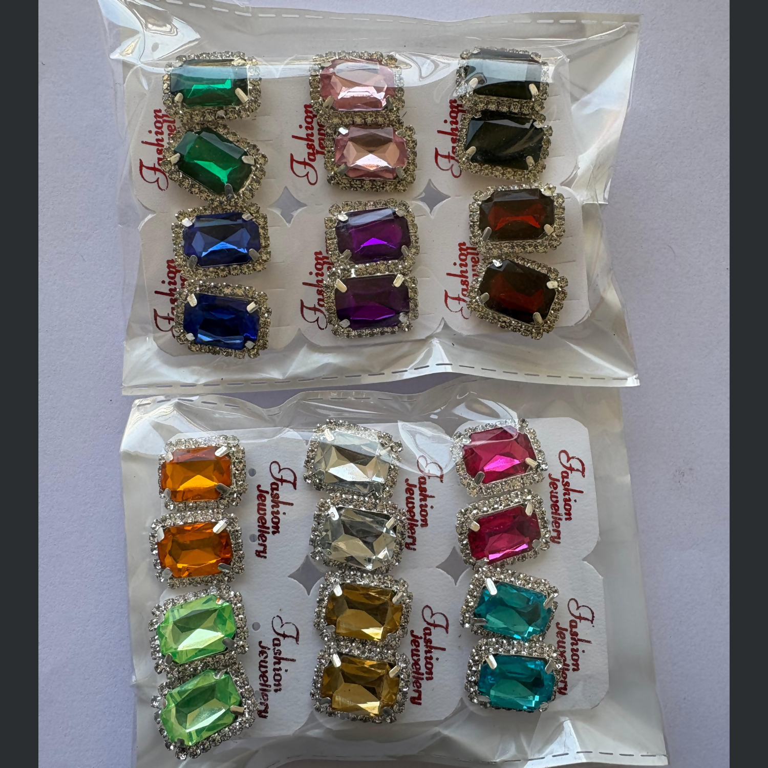 Graphic showing '12 PAIRS' & 'EMERALD CUT' for crystal stud earrings.