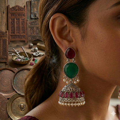 Model wearing oxidised silver jhumka earrings with traditional Indian attire